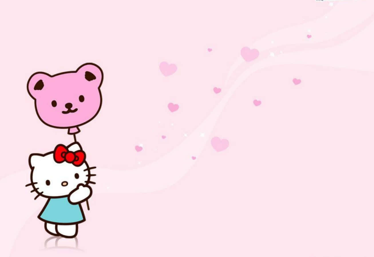 Сладък лаптоп с тематика Hello Kitty Тапет