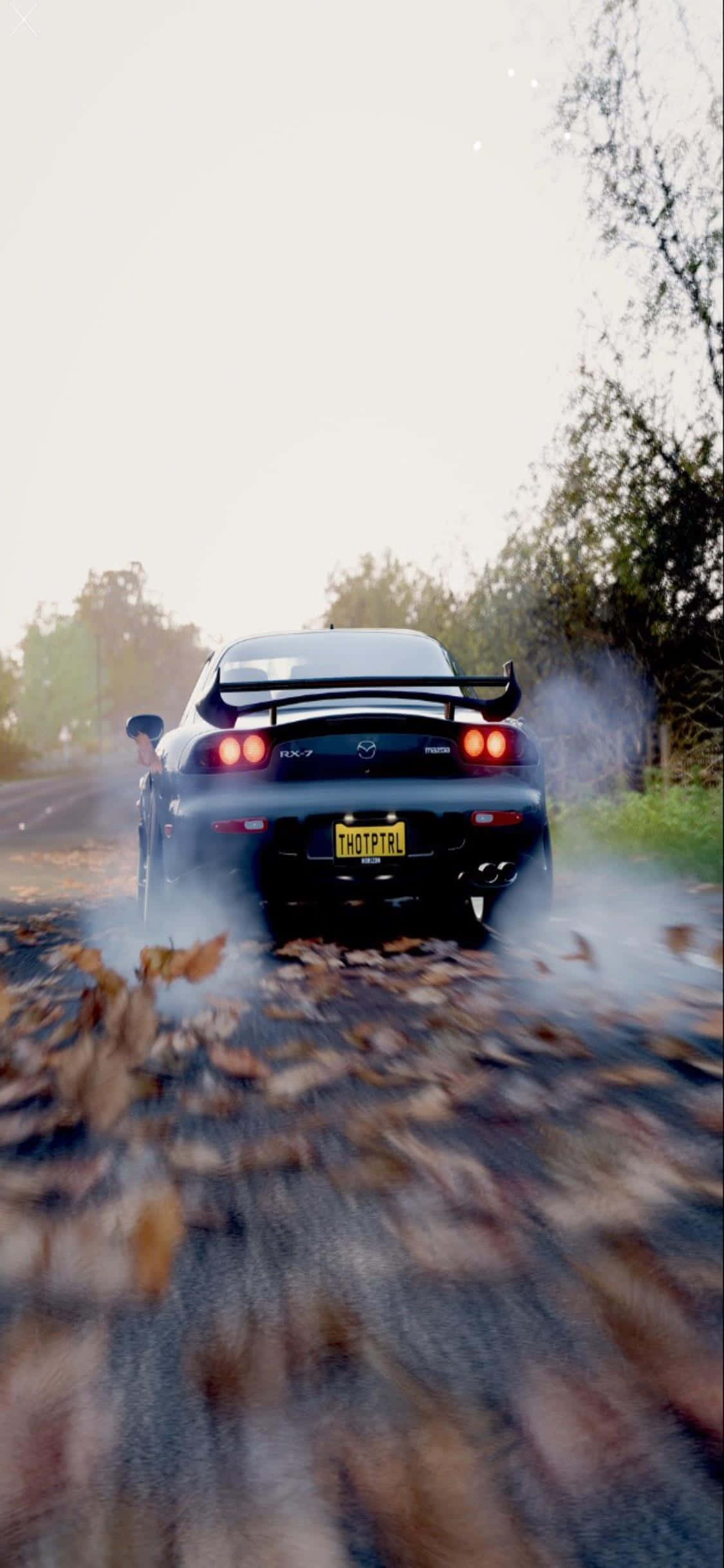 Насладете се на висококачествена графика и потапящо изживяние с iPhone Xs и Forza Horizon 4 Тапет