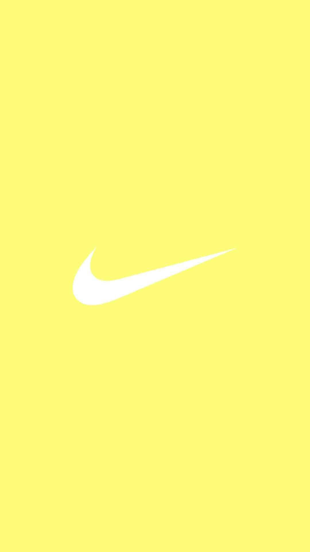Жълт фон с лого на Nike за телефон Тапет