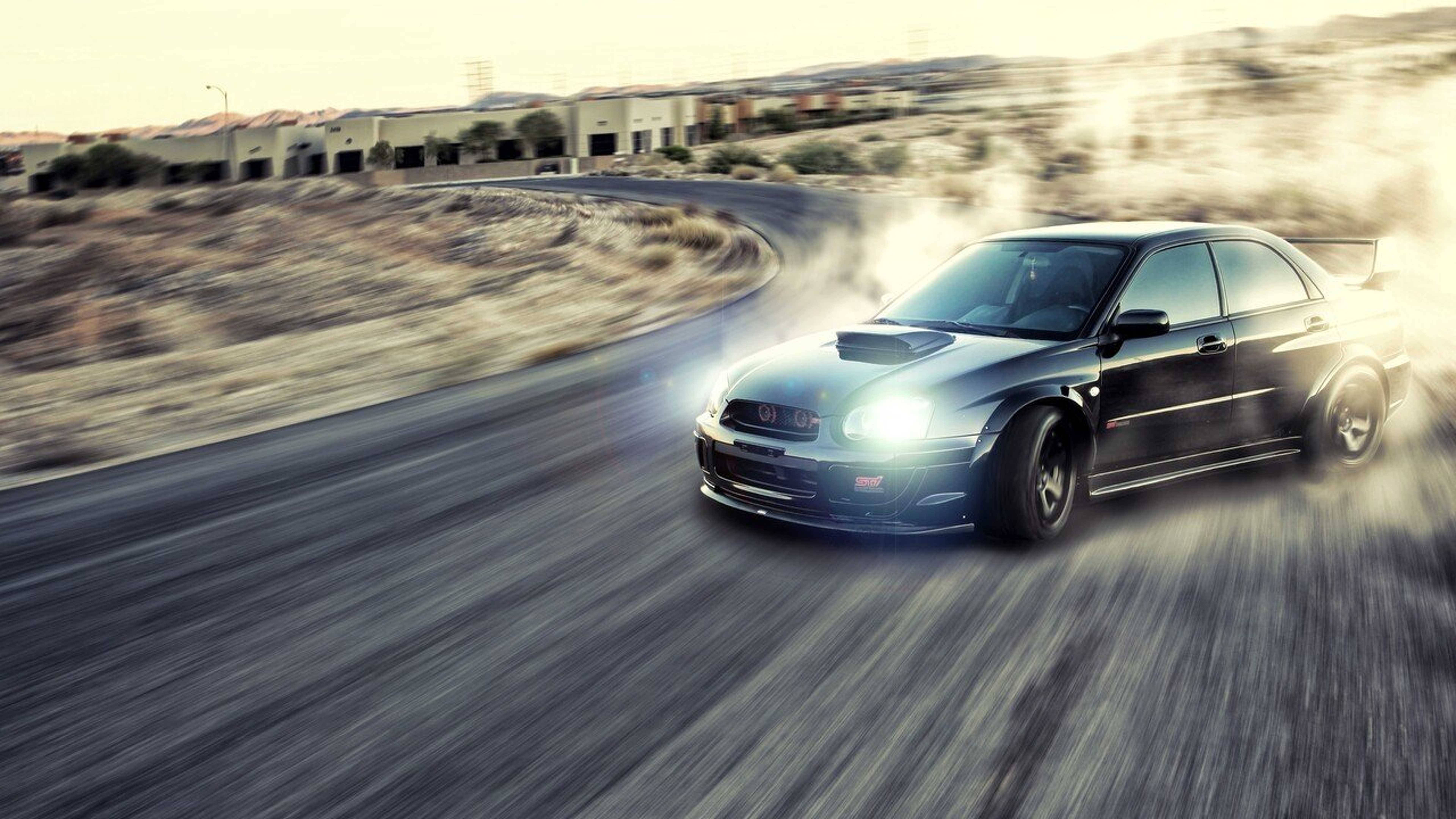 Надбягваща се Subaru Impreza WRX дрифт кола в действие Тапет