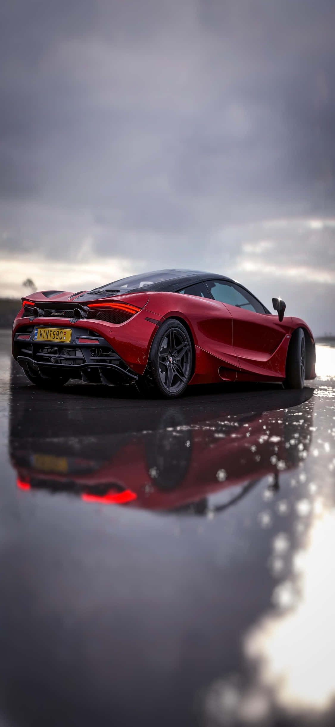 Изживейте скорост и лукс с iPhone Xs Mclaren 720s Тапет