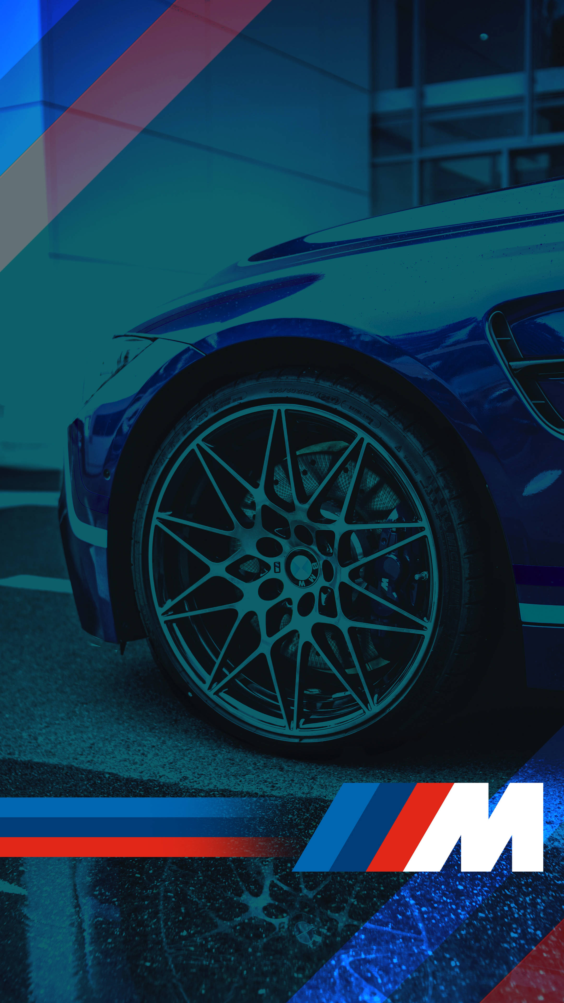 Син автомобилен джант с лого на BMW M Тапет