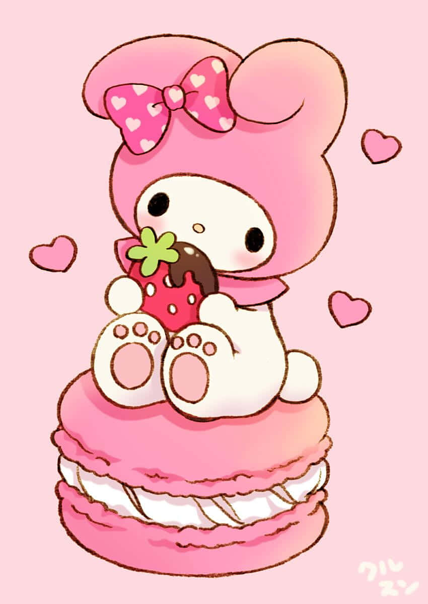 Сладката My Melody яде ягода върху макарон