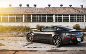 Aston Martin Vanquish в действие на живописен път — Steam Deck OLED Тапет