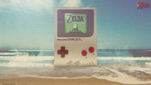 Тапет с гигантски Nintendo Game Boy на плажа