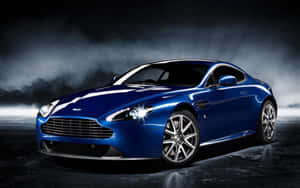 Зашемящ Aston Martin DB9 в движение по живописен маршрут — Steam Deck OLED Тапет