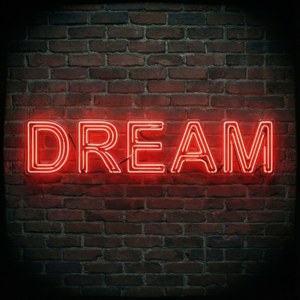 Вдъхновляюща неонова червена табела DREAM на тухлена стена.