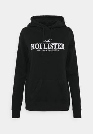 Минималистично черно худи яке от Hollister тапет — Чист Тапет