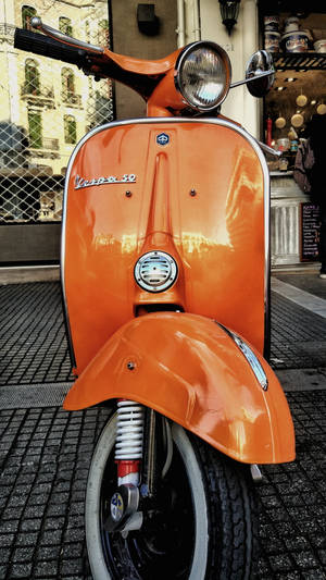 Тапет с ретро естетика оранжев Vespa 50 — Емо естетика GIF Тапет