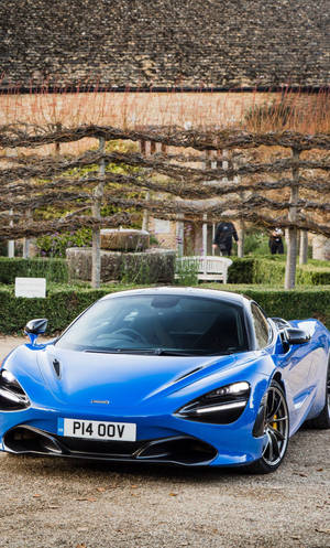 Синь McLaren 720S в градина за телефон — Коли Тапет
