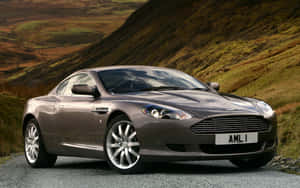 Стилен Aston Martin DB9 на отворен път — Steam Deck OLED Тапет